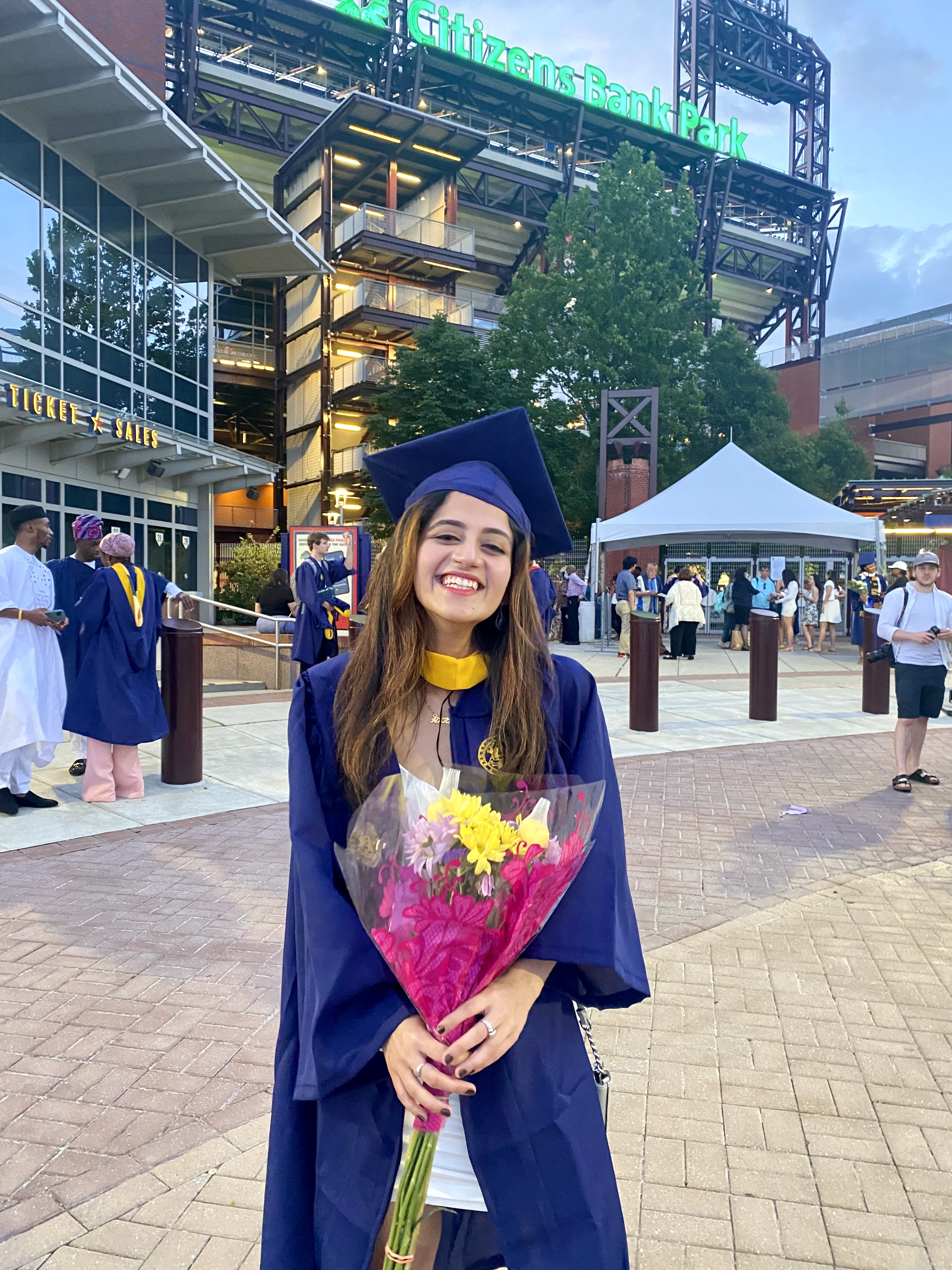 Akriti celebrating Drexel graduation outside Citizens Bank Park